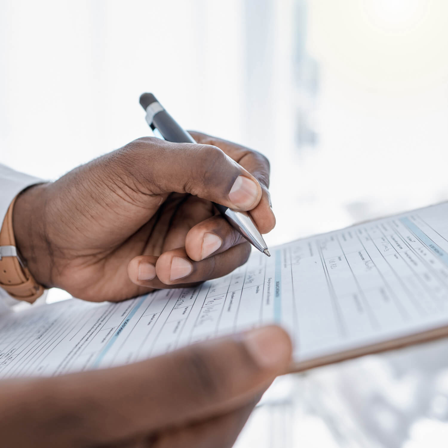 Patient completing medical records request form for Knoxville Orthopaedic Clinic